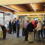 This is a picture of some of the members of the congregation talking in the great hallway.