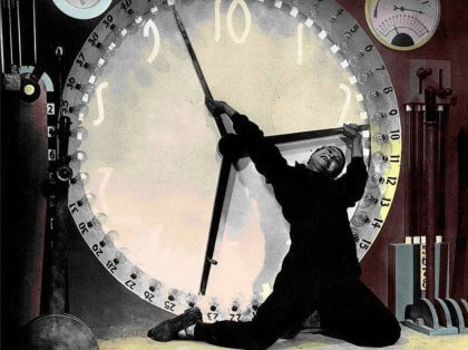 A person dramatically poses in front of a large clock face with industrial elements in the background.
