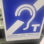 Sign indicating a hearing loop system is installed.